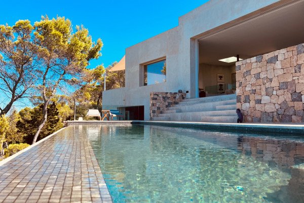 A luxury private villa with a full view of Cala San Vincent bay, unique in location, unrivalled